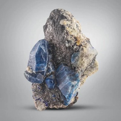 Rare elongated vivid blue Afghanite crystals on Calcite from Afghanistan